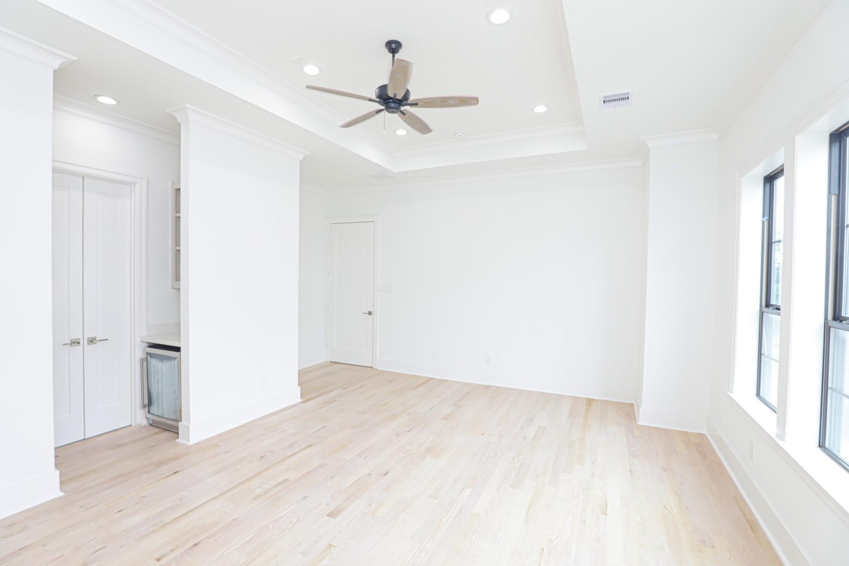 2122 Blalock Road, Unit B Houston, TX 77080 - Photo 9 of 45 wooden floor in an empty room with a window