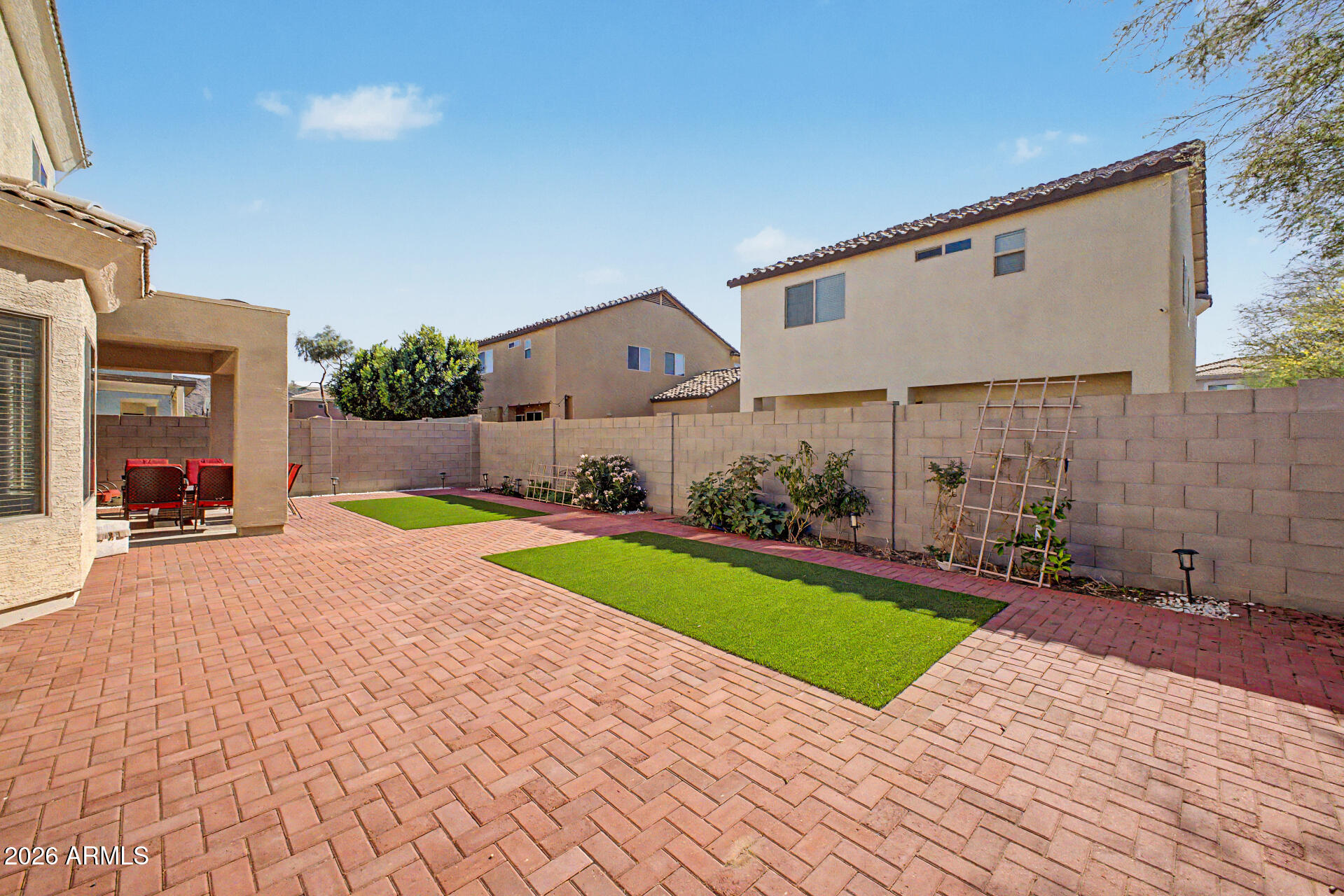 7206 South 12th Way Phoenix, AZ 85042 - Photo 29 of 34 a view of a house with a yard and a patio