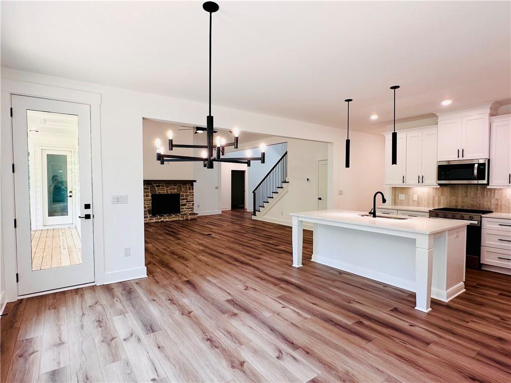 6312 Woodstock Road Acworth, GA 30102 - Photo 13 of 44 a view of kitchen with sink microwave and stove
