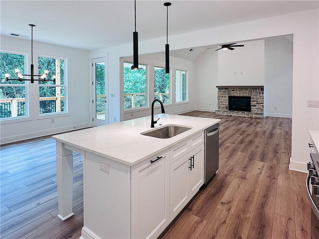 6312 Woodstock Road Acworth, GA 30102 - Photo 14 of 44 a kitchen with a sink and wooden floor