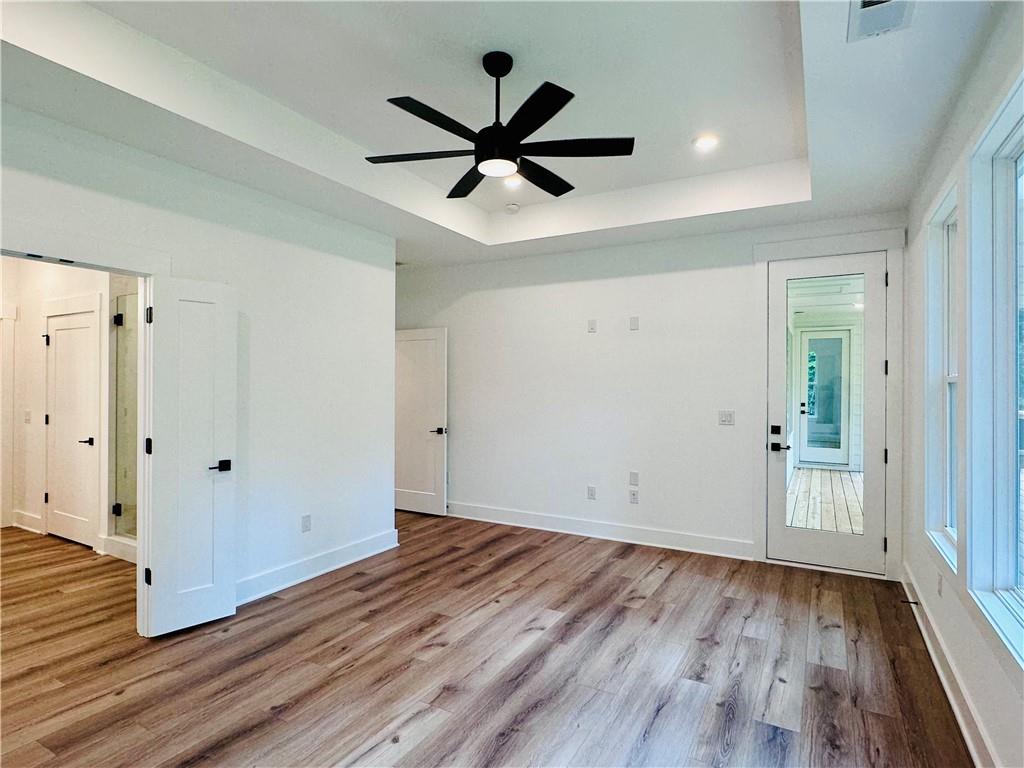 6312 Woodstock Road Acworth, GA 30102 - Photo 17 of 44 a view of empty room with wooden floor