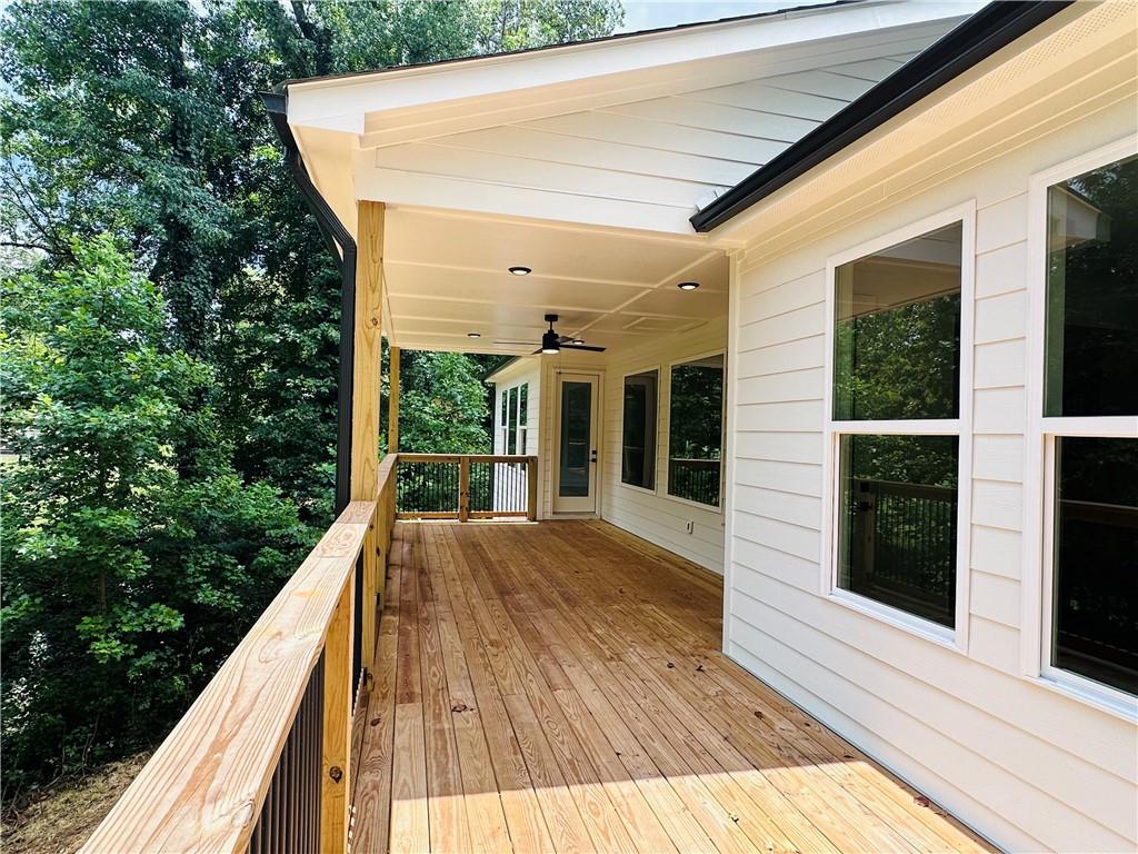 6312 Woodstock Road Acworth, GA 30102 - Photo 2 of 44 a view of balcony with balcony and wooden floor