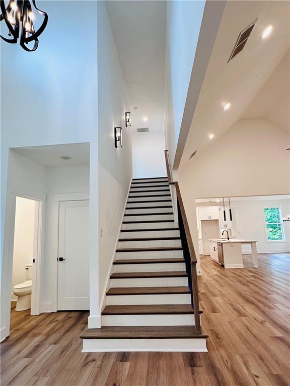 6312 Woodstock Road Acworth, GA 30102 - Photo 25 of 44 a view of a hallway with wooden floor and stairs