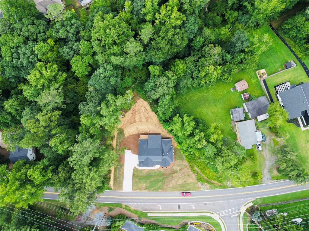 6312 Woodstock Road Acworth, GA 30102 - Photo 35 of 44 an aerial view of a house with a yard