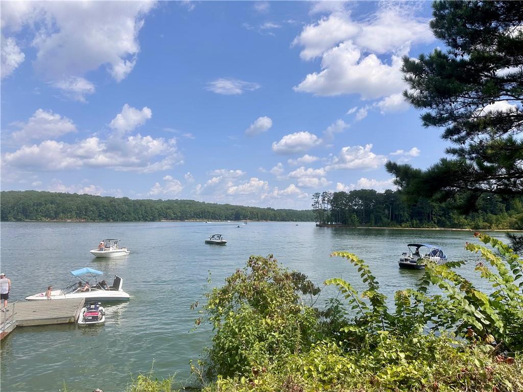 6312 Woodstock Road Acworth, GA 30102 - Photo 39 of 44 a view of a lake with houses in the back