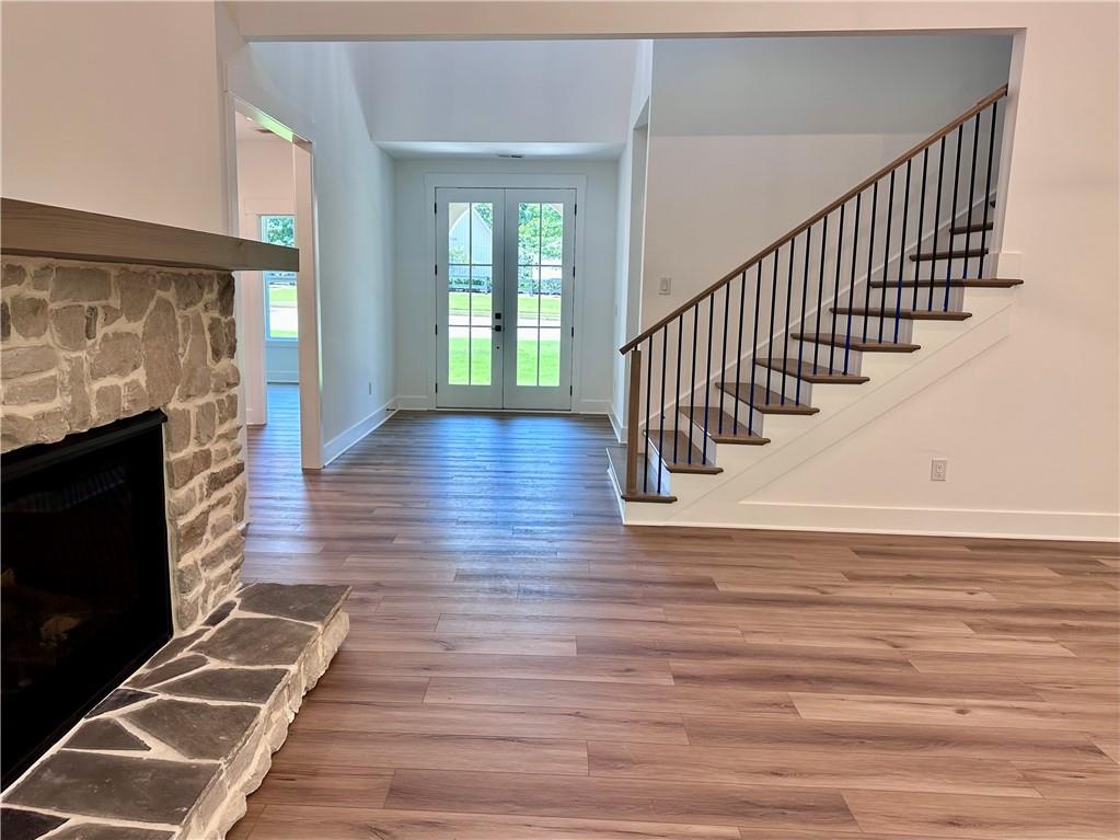 6312 Woodstock Road Acworth, GA 30102 - Photo 42 of 44 a view of entryway and hall with wooden floor