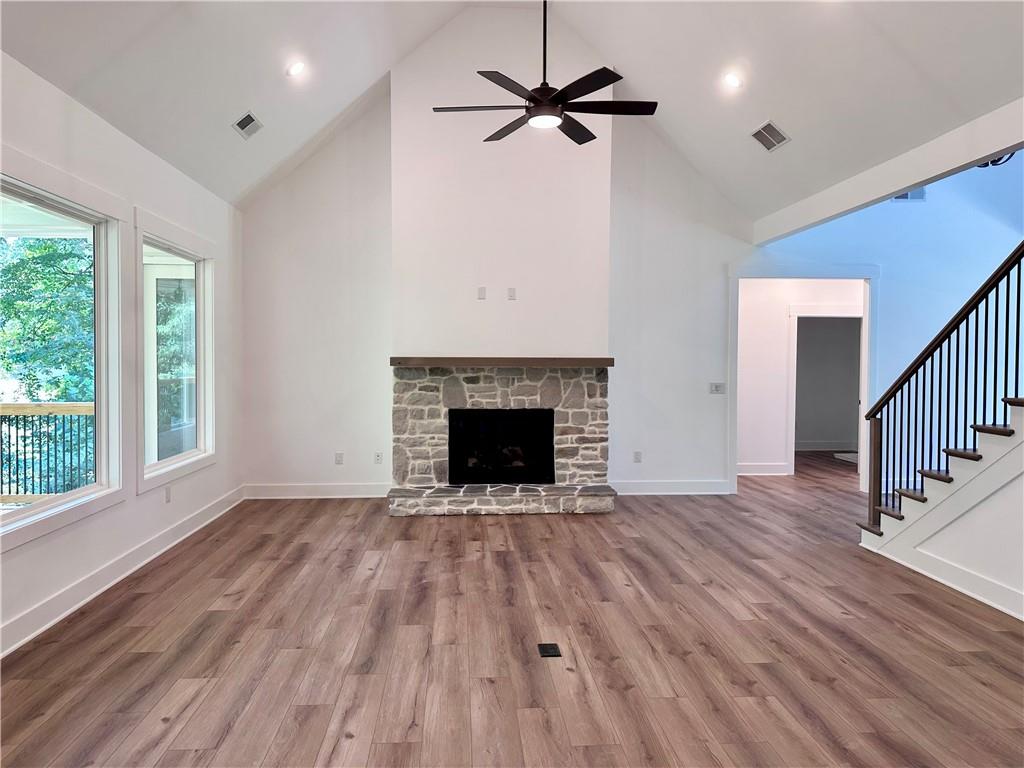 6312 Woodstock Road Acworth, GA 30102 - Photo 7 of 44 a view of an empty room with wooden floor fireplace and a window