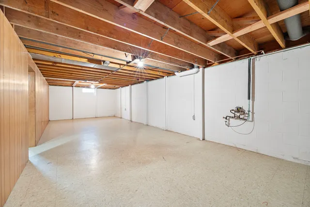 a living room with furniture and a ceiling fan