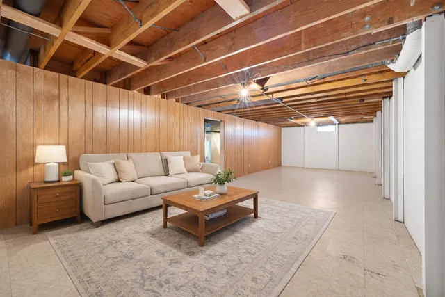 a view of empty room with wooden walls