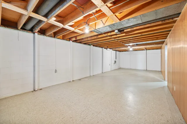 a view of a room with wooden walls