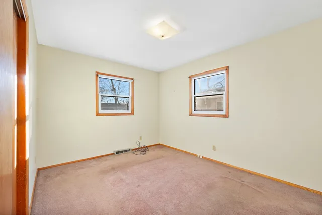 a view of room with window and ceiling fan