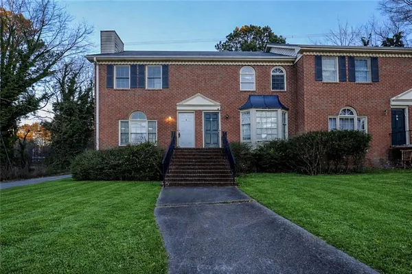 a front view of a house with yard