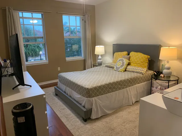 a bedroom with a bed and window