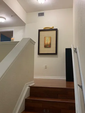 a bathroom with a shower and a sink