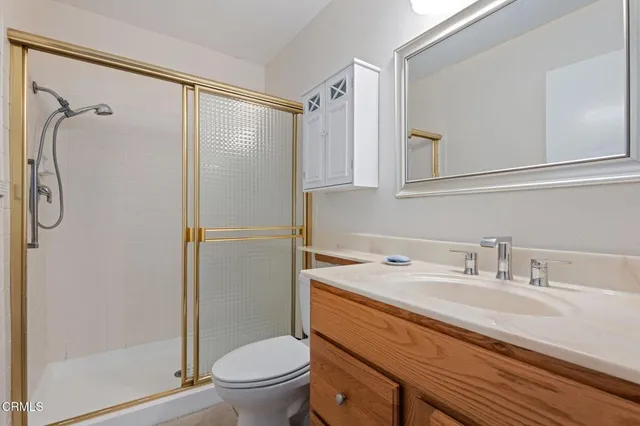 a view of a room with furniture and windows