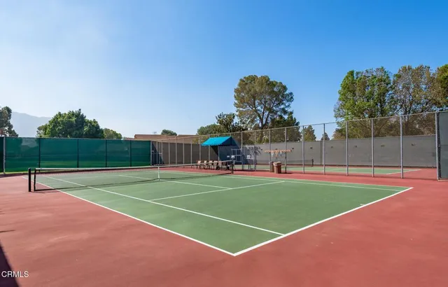 a view of an outdoor space and tennis court