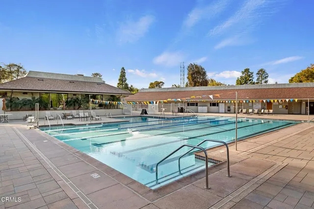 a view of swimming pool with outdoor seating