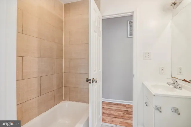 a bathroom with a bathtub and shower