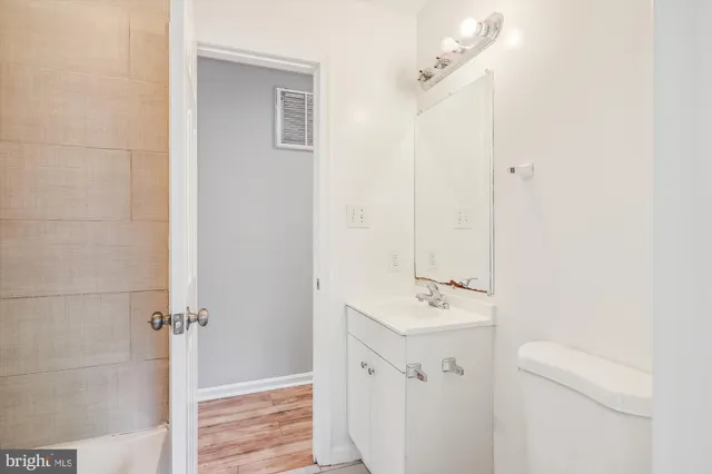 a bathroom with a sink a mirror and shower