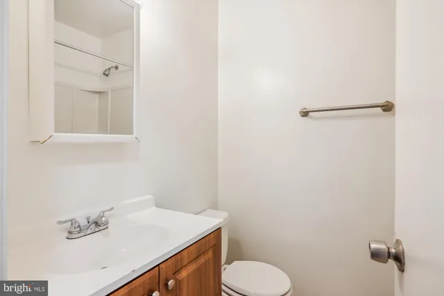 a bathroom with a sink toilet and vanity