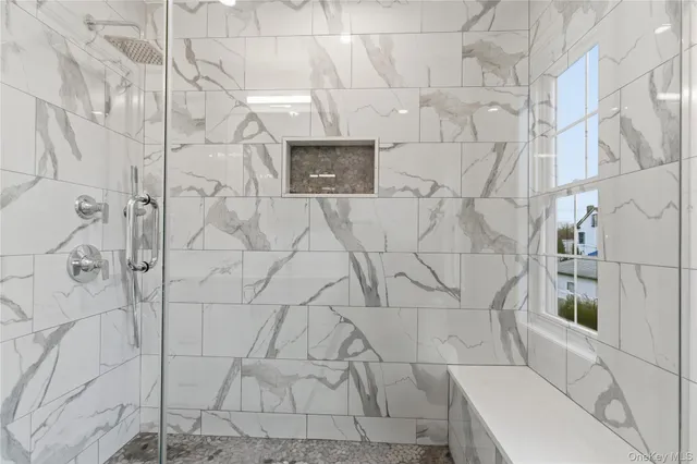 a bathroom with a sink toilet tub and shower