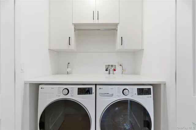 a bathroom with a toilet a sink a mirror a window and vanity