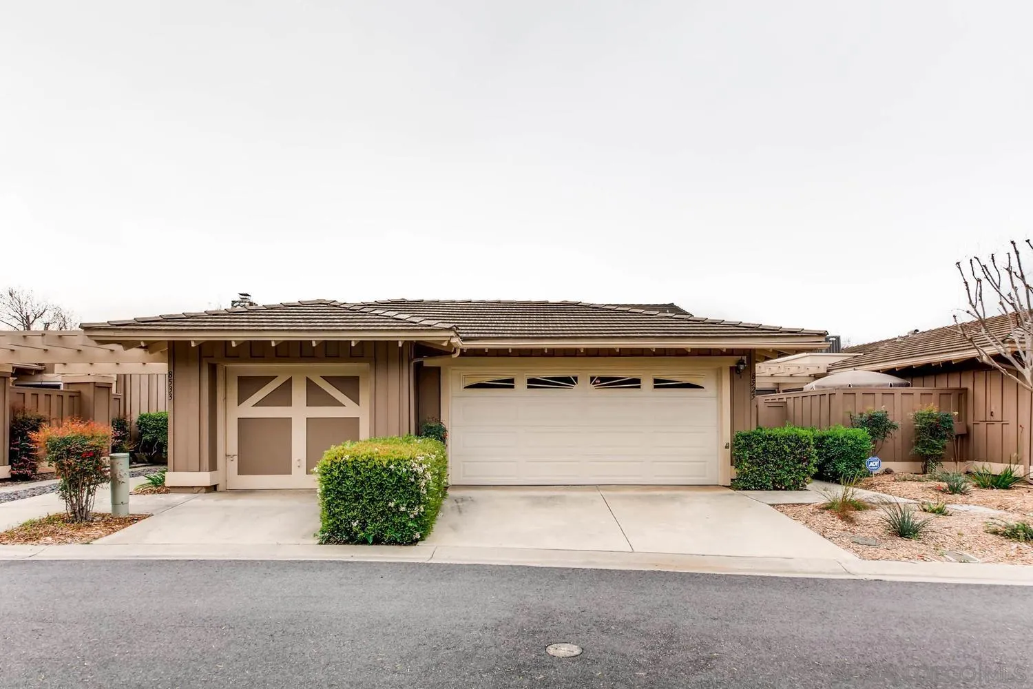 8525 Circle R Course Lane Escondido, CA 92026 - Photo 1 of 13 a front view of a house with a garage
