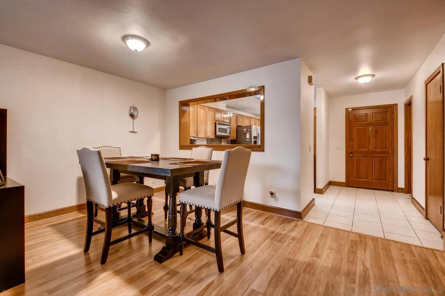 8525 Circle R Course Lane Escondido, CA 92026 - Photo 3 of 13 a view of a dining room with furniture and wooden floor