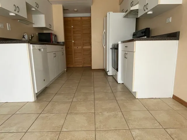 a bathroom with a bath tub with a shower