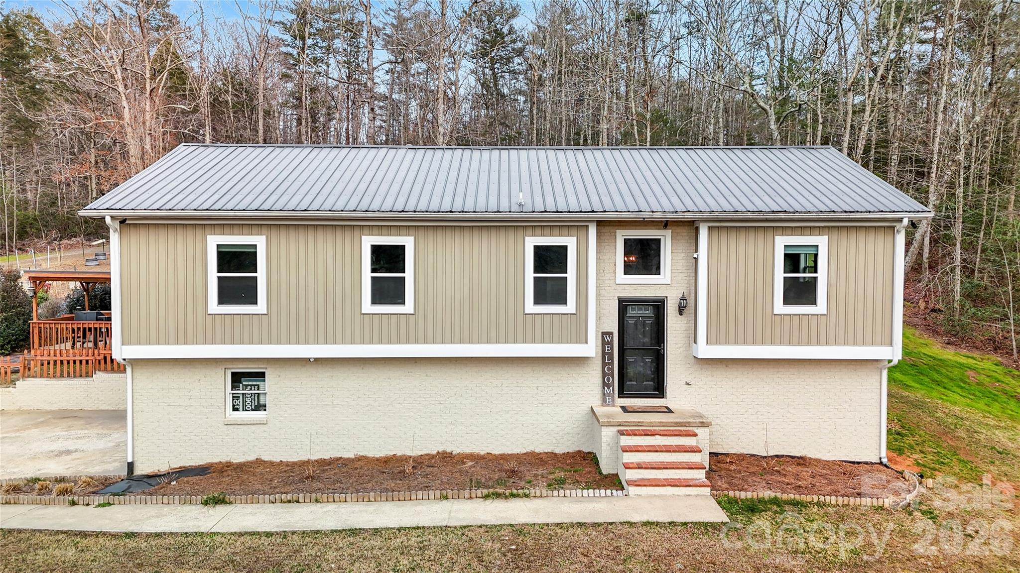 4386 Rocky Road Lenoir, NC 28645 - Photo 2 of 43 a front view of a house with a yard