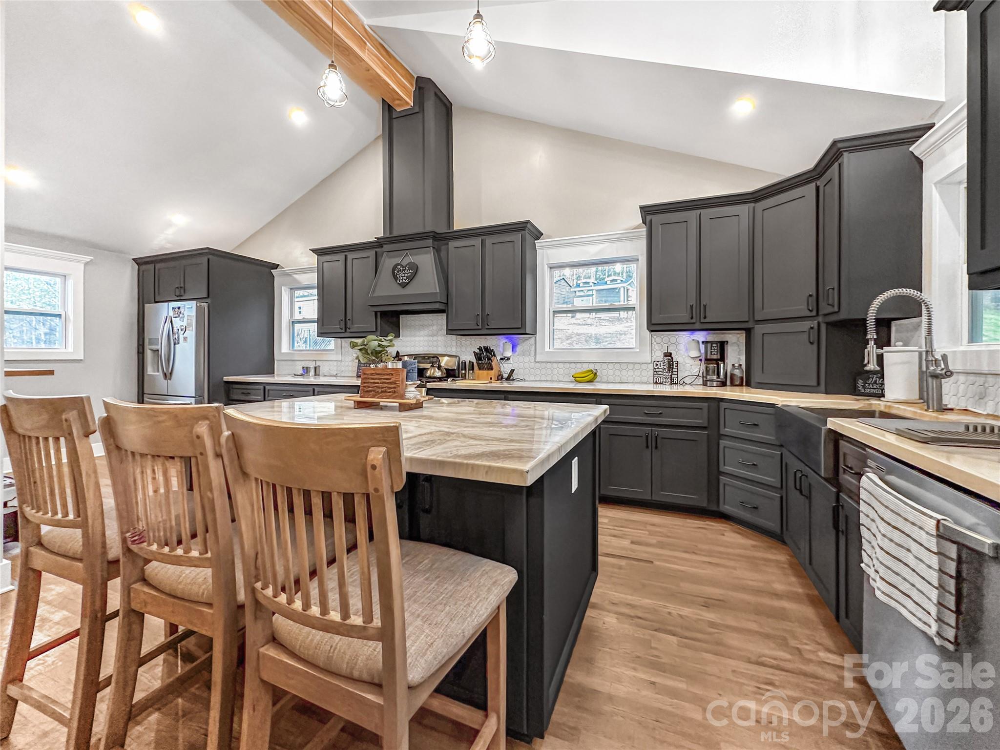 4386 Rocky Road Lenoir, NC 28645 - Photo 29 of 43 a kitchen with a sink stainless steel appliances and cabinets