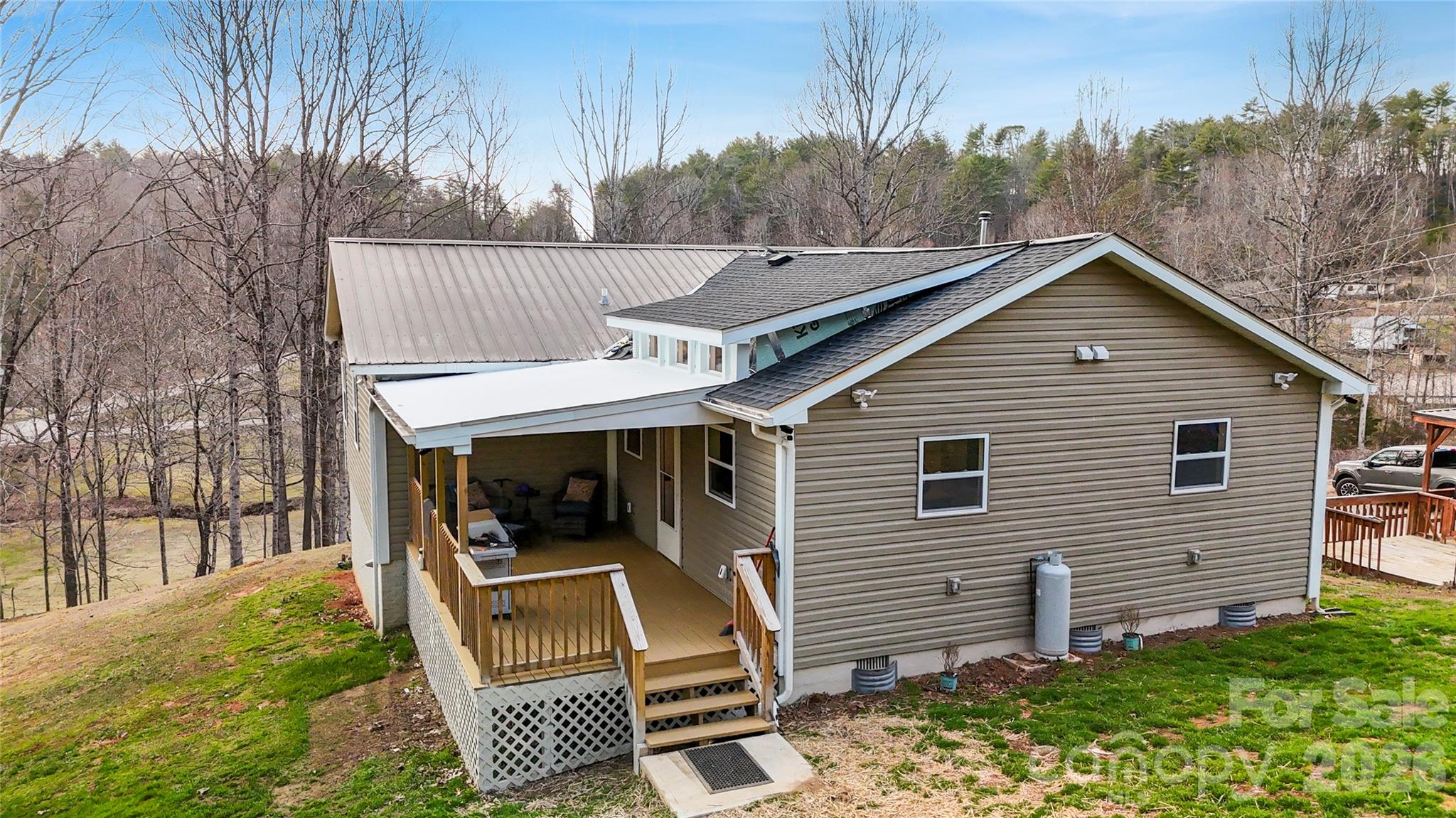 4386 Rocky Road Lenoir, NC 28645 - Photo 3 of 43 a view of house with backyard and trees