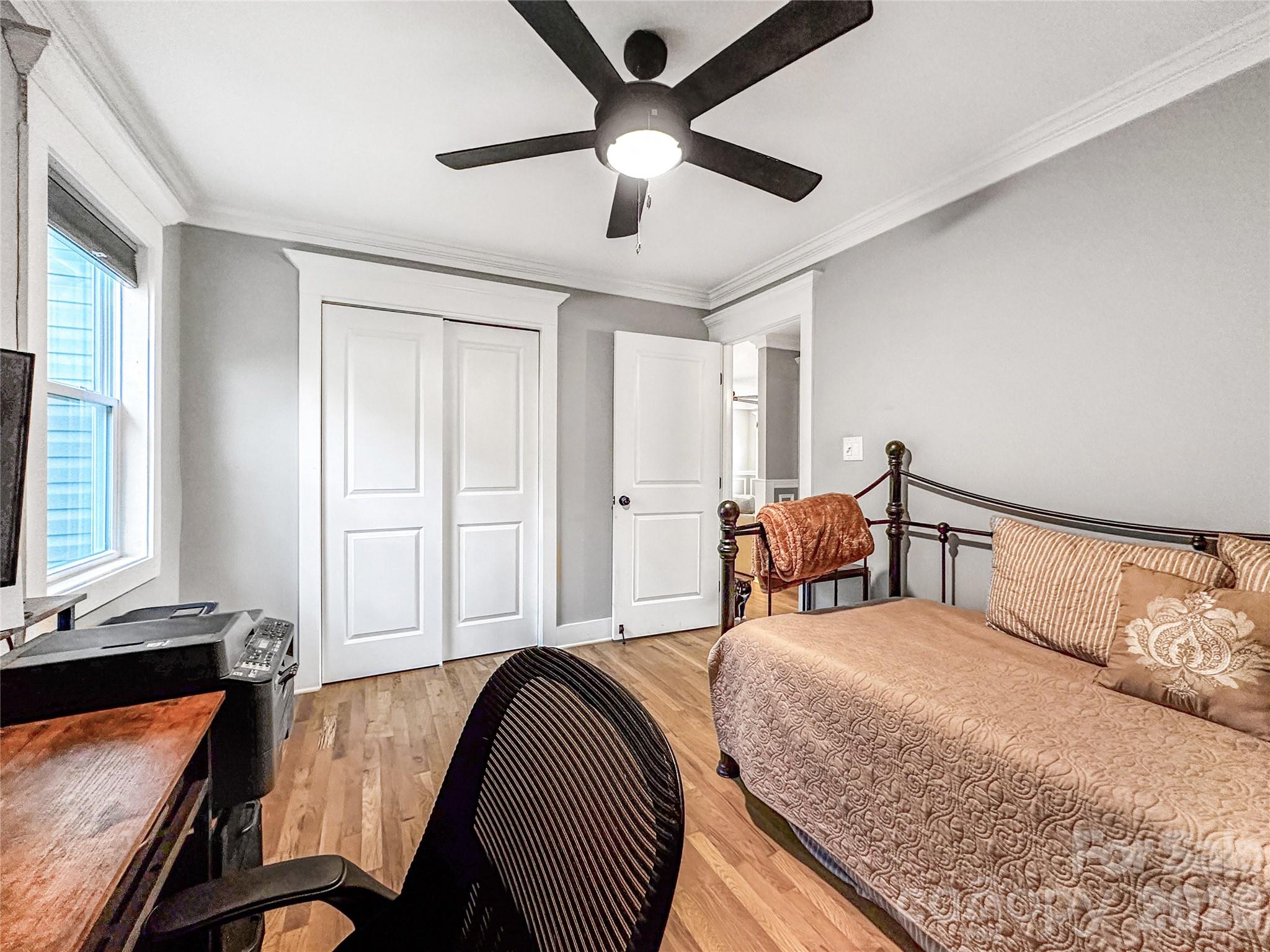 4386 Rocky Road Lenoir, NC 28645 - Photo 34 of 43 a bedroom with a bed and a chandelier