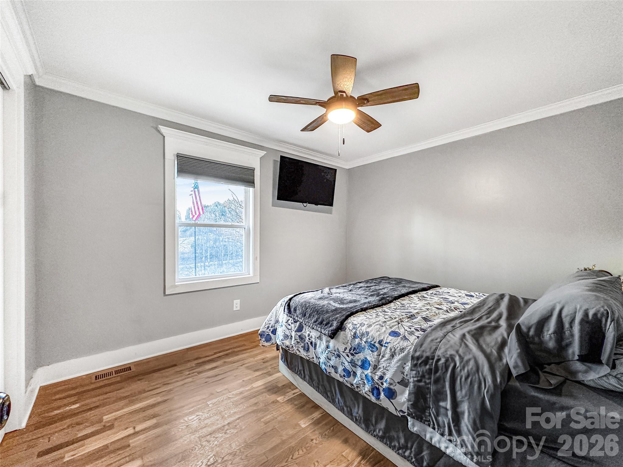 4386 Rocky Road Lenoir, NC 28645 - Photo 35 of 43 a bedroom with a bed and a window