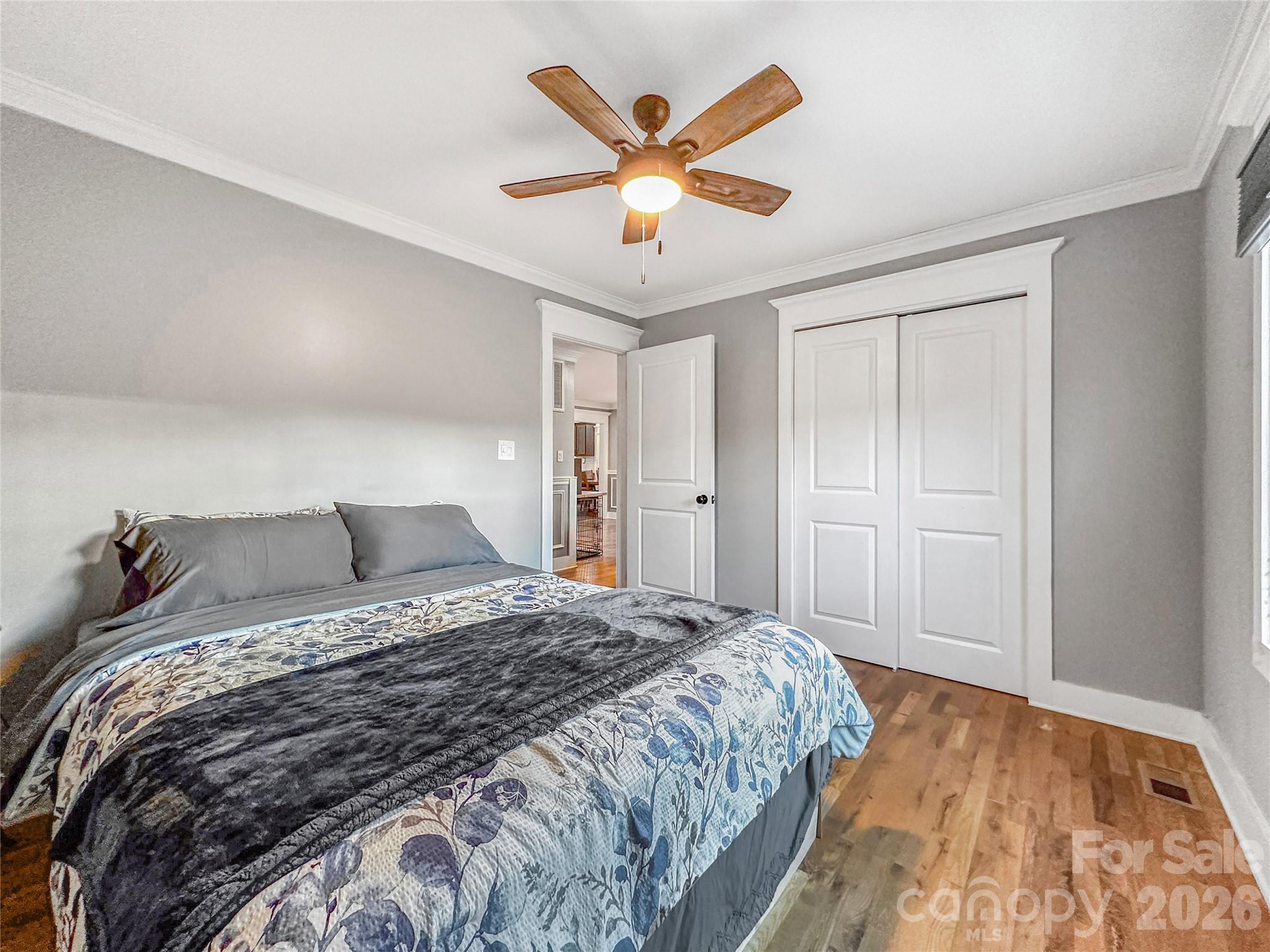 4386 Rocky Road Lenoir, NC 28645 - Photo 36 of 43 a bedroom with a large bed and a ceiling fan