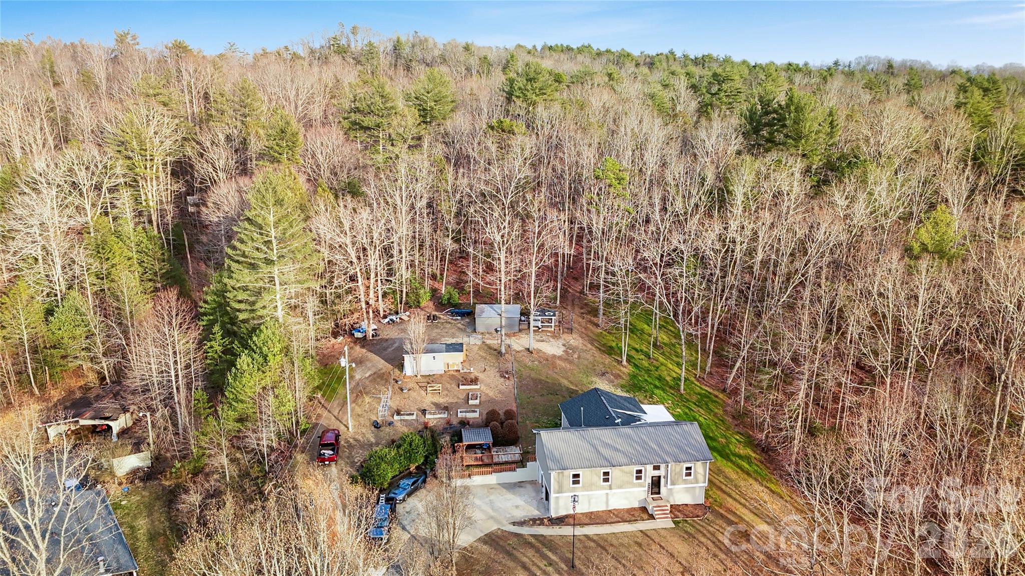 4386 Rocky Road Lenoir, NC 28645 - Photo 9 of 43 a view of a city with lush green forest