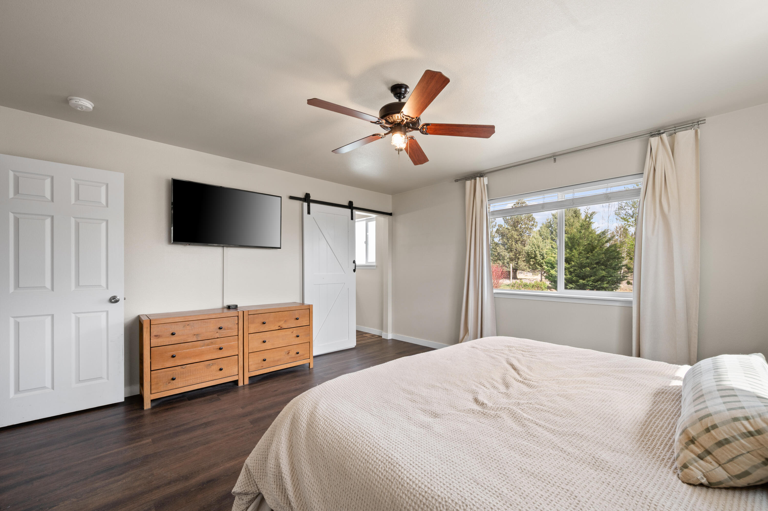 16625 Southwest Dove Road Terrebonne, OR 97760 - Photo 23 of 50 a bedroom with a bed and a flat screen tv