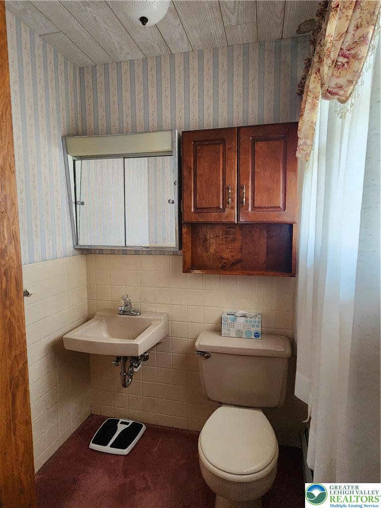 90 Porter Street Nazareth, PA 18064 - Photo 11 of 19 a bathroom with a toilet a sink and a mirror
