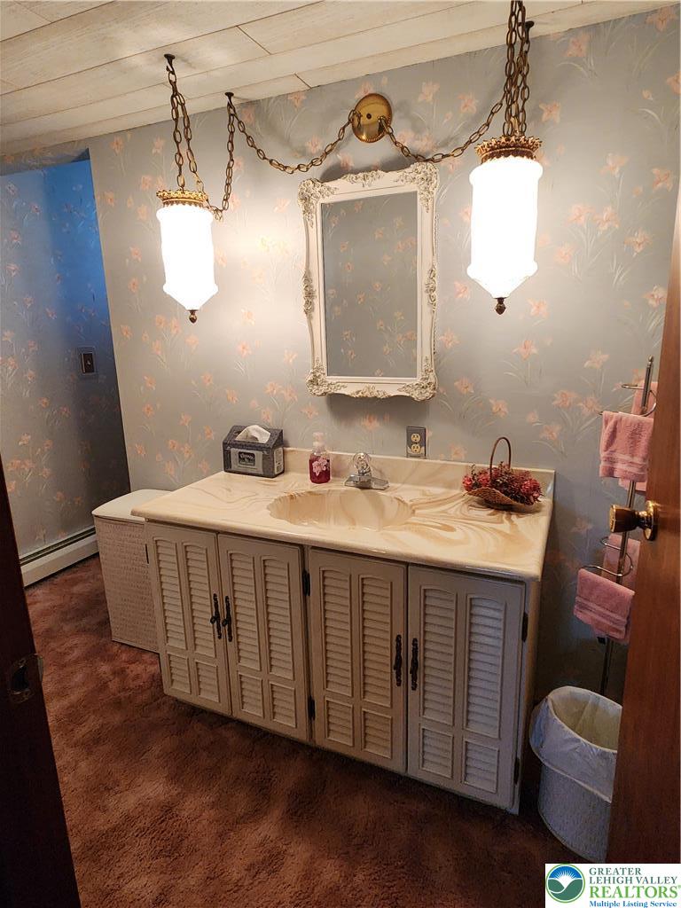 90 Porter Street Nazareth, PA 18064 - Photo 12 of 19 a bathroom with a sink and a mirror