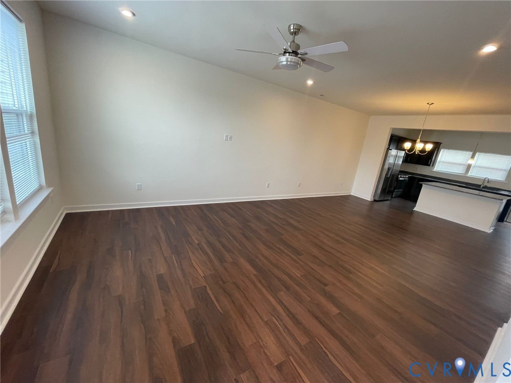 12201 Lightning Bug Loop Midlothian, VA 23112 - Photo 7 of 11 Spacious open-concept room featuring wood-finish f