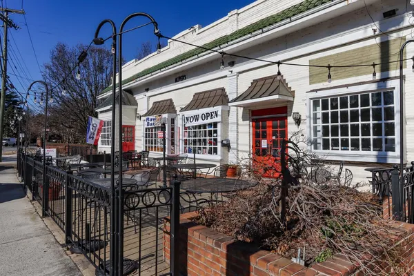 a bedroom with a bed and a mirror on dresser