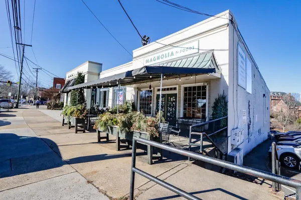 a view of a building with sitting area