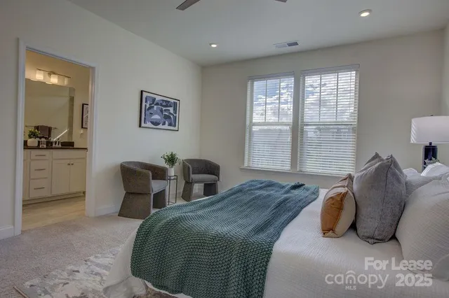 a bedroom with bed and window