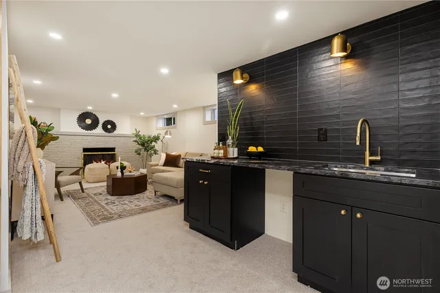 a kitchen with a sink counter top space and a fireplace