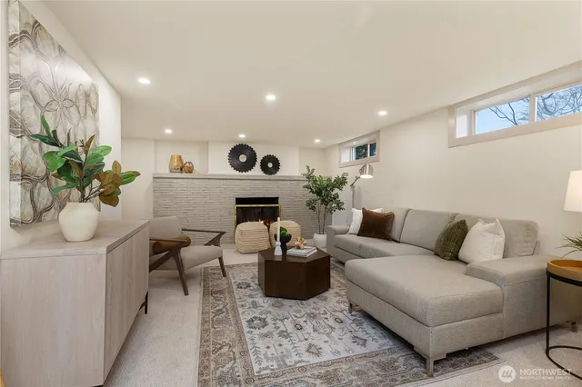 a living room with furniture potted plant and a fireplace