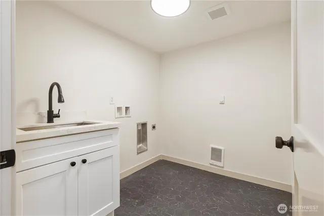 a bathroom with a sink and vanity