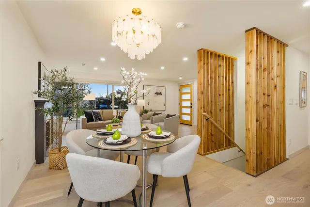 a view of a dining room with furniture chandelier and a chandelier