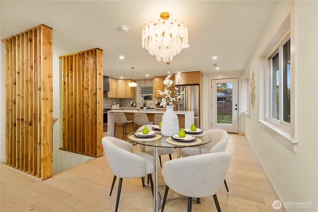 a view of a dining room with furniture window and outside view