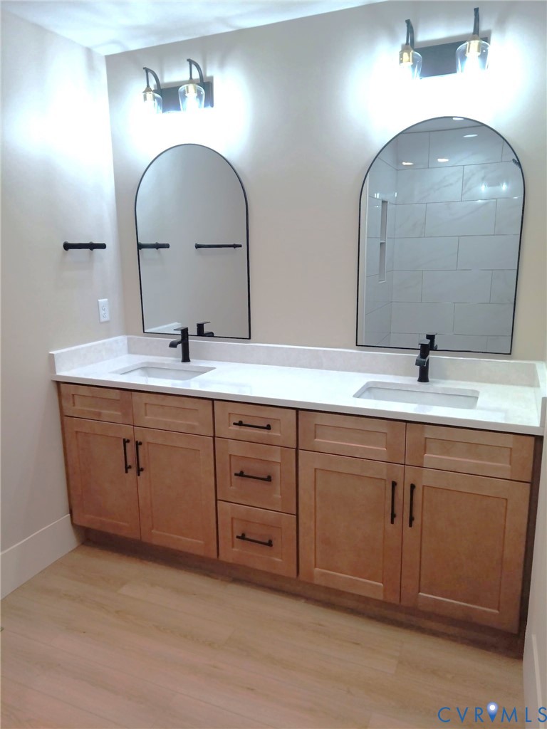 320 Vogel Road Cumberland, VA 23040 - Photo 19 of 28 a bathroom with a double vanity sink and a mirror