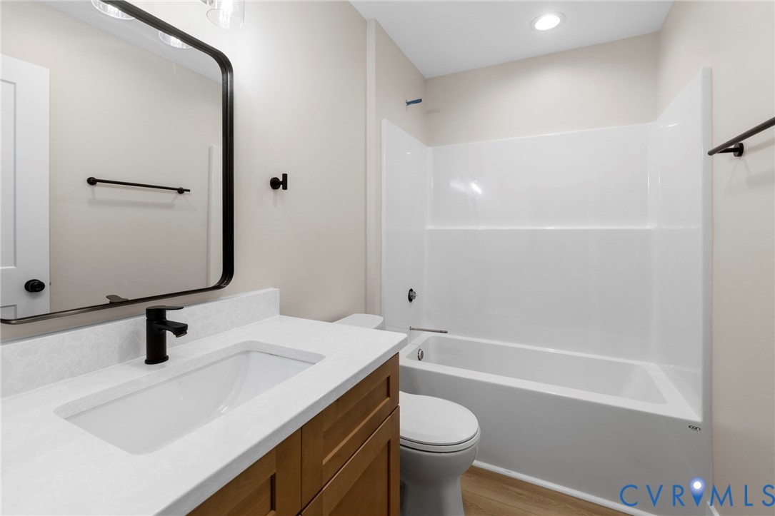 320 Vogel Road Cumberland, VA 23040 - Photo 23 of 28 a bathroom with a sink a toilet and shower